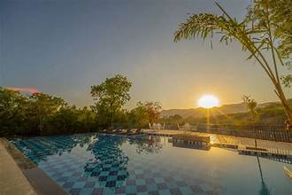 Infinity pool at Amrutham Bagh, lit at night