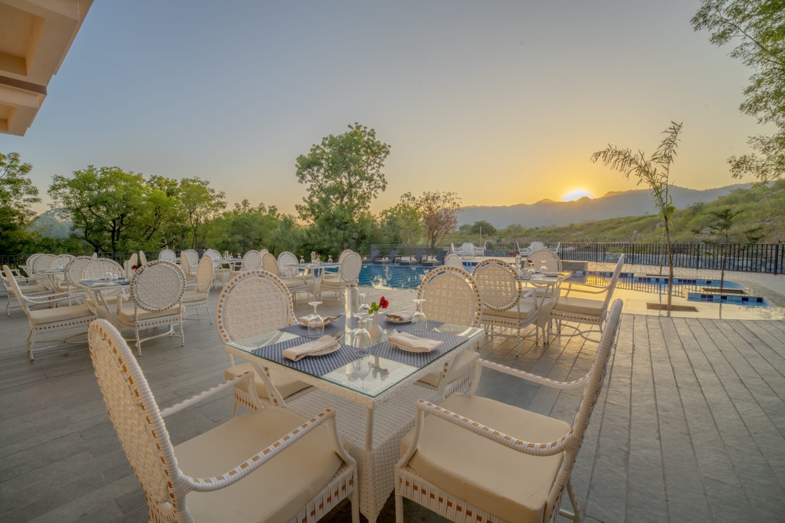 Poolside dining at sunset, Amrutham Bagh
